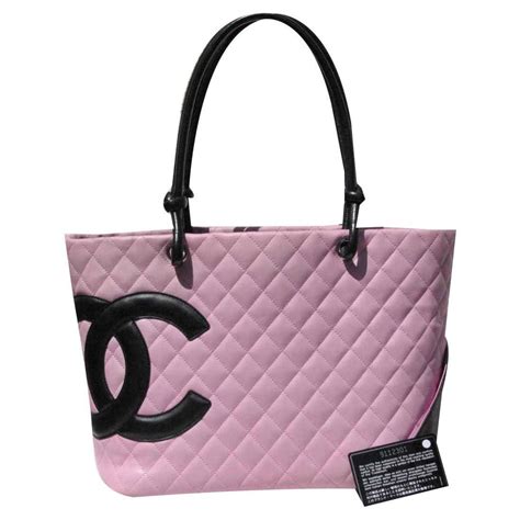 the pink chanel|Chanel purses pink and black.